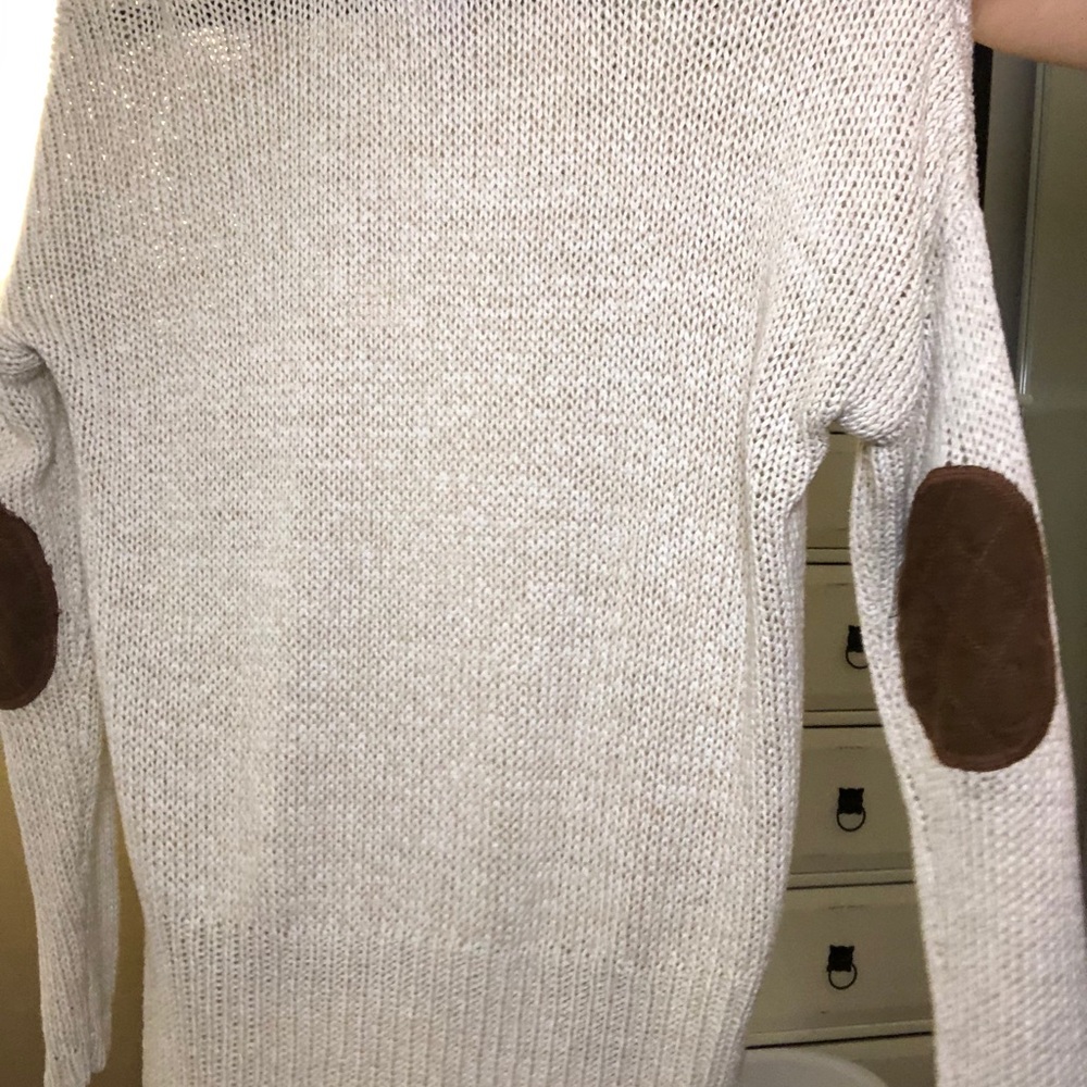 Cream knotted sweater with brown elbows